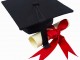 Close up of a graduation cap and a certificate with a ribbon